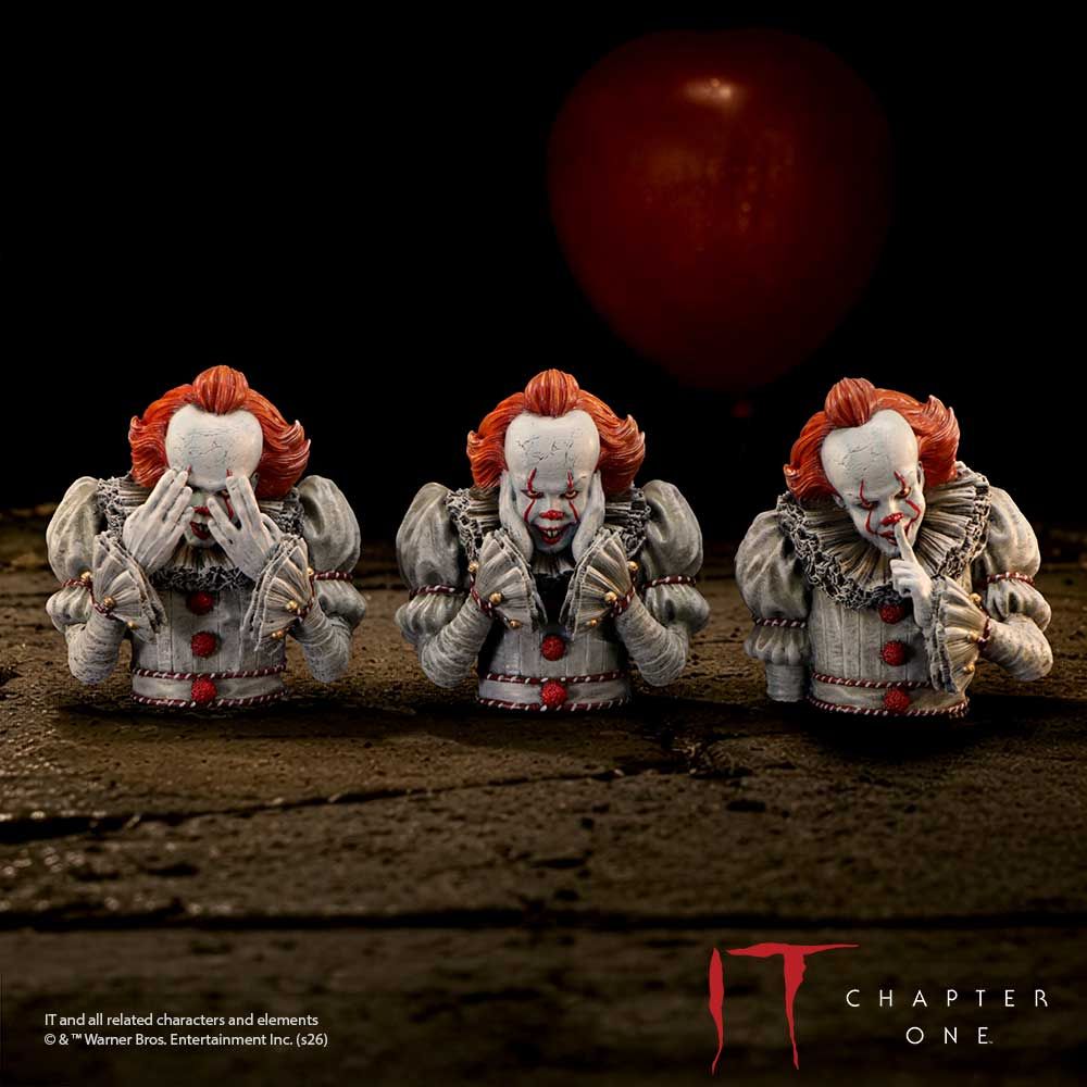 IT Three Wise Pennywise figurines displayed with red balloon