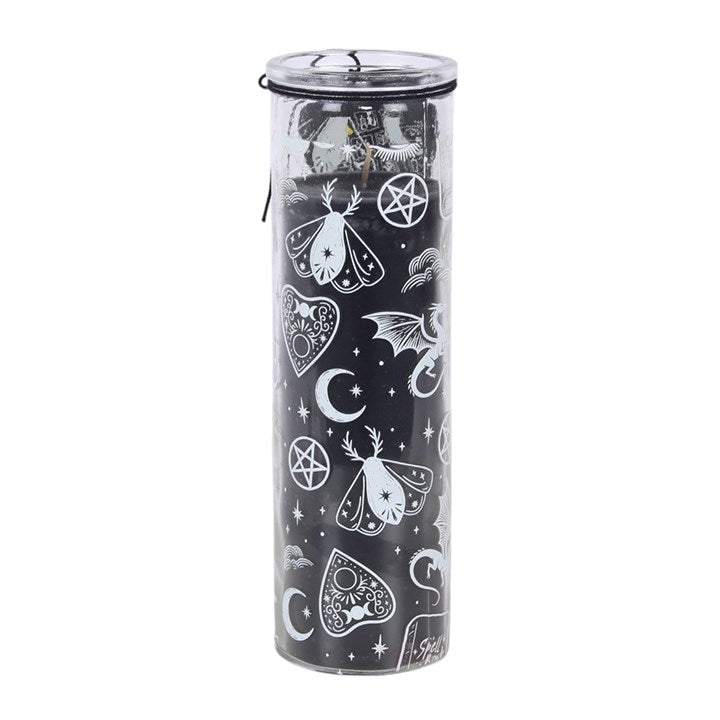 A tall, cylindrical clear glass jar filled with black wax and decorated with white occult-themed illustrations including moons, stars, pentagrams, and butterflies, topped with a clear lid.
