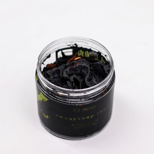 Open jar of Graveyard Shift Whipped Soap showing black whipped texture