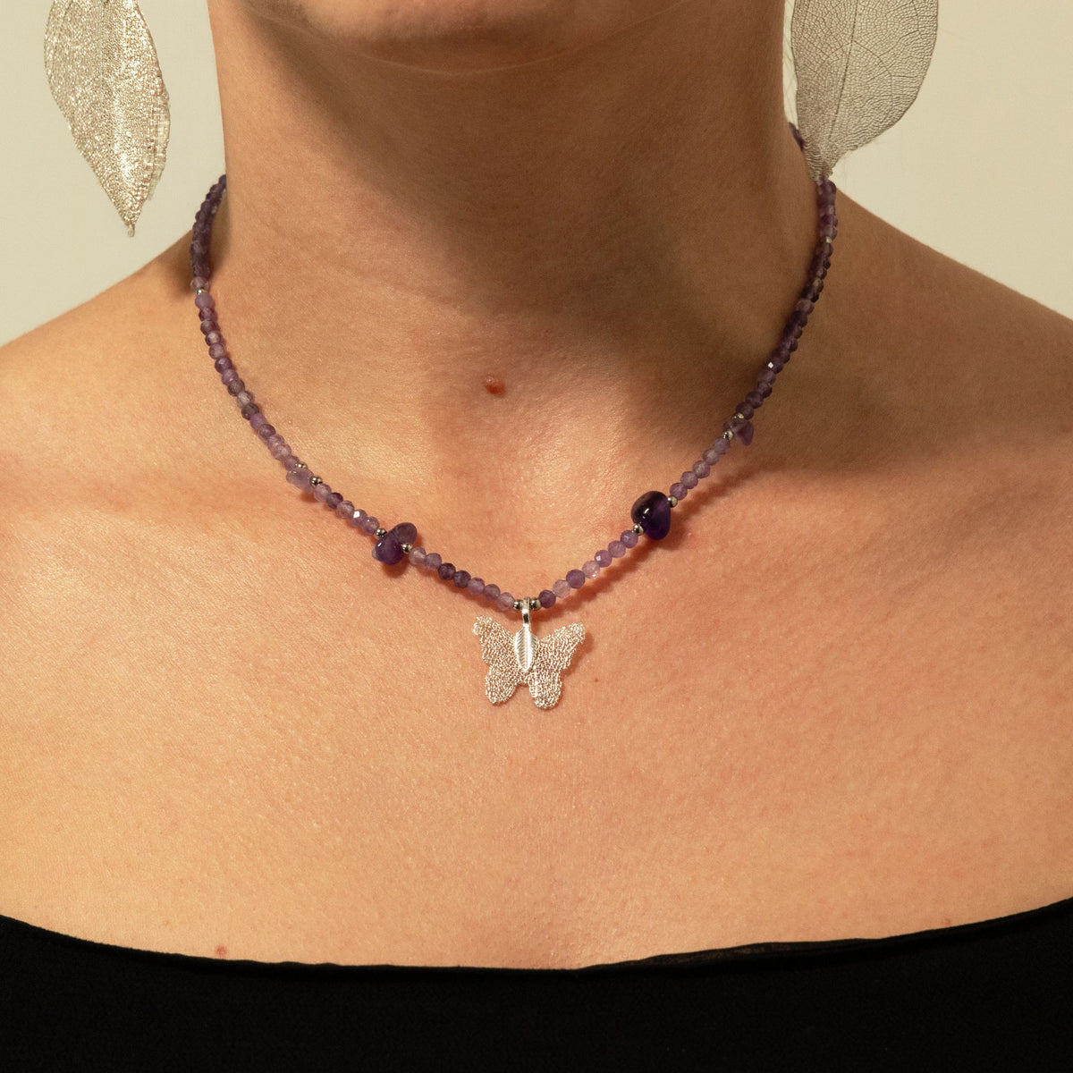 1. Nymph amethyst gemstone necklace worn around the neck