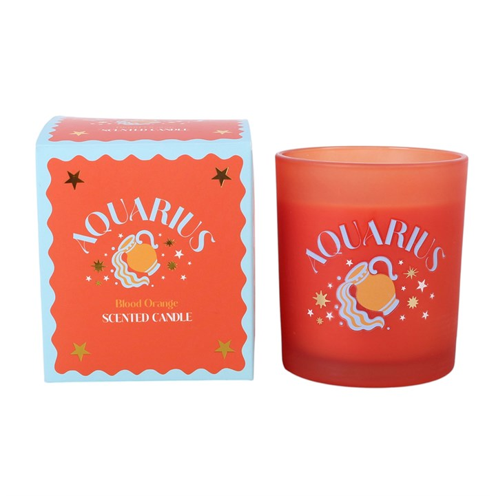 Aquarius zodiac candle in orange-red glass holder with packaging