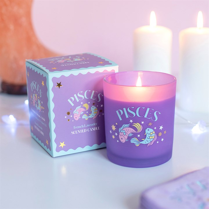 Zodiac Zest Pisces French lavender scented candle lit beside gift box