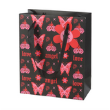 Black gift bag with red butterfly and flower pattern on a white background