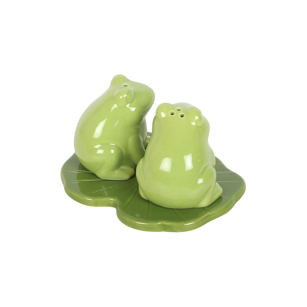 Green ceramic frog salt and pepper shakers on lily pad side view