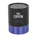 Cylindrical candle container with 'The Coven' branding and purple base on a white background