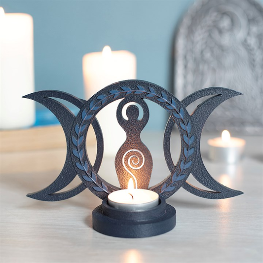 Triple Goddess resin tealight holder with lit candle