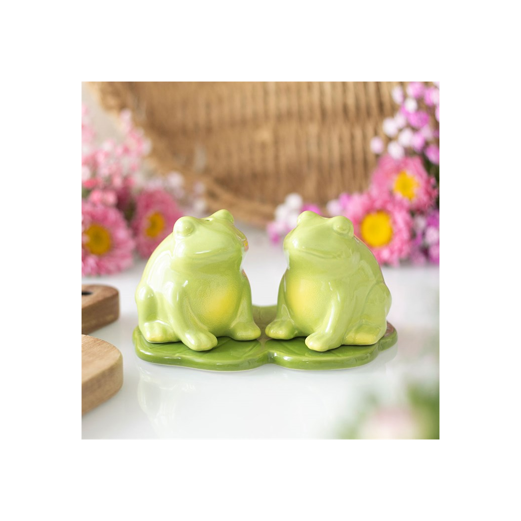 Green ceramic frog salt and pepper shakers on lily pad