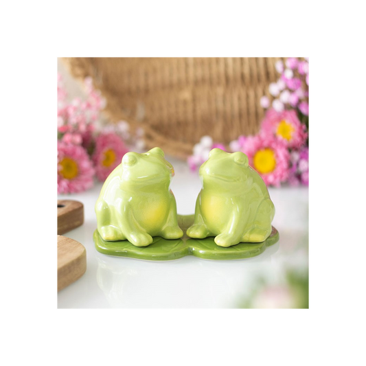 Green ceramic frog salt and pepper shakers on lily pad