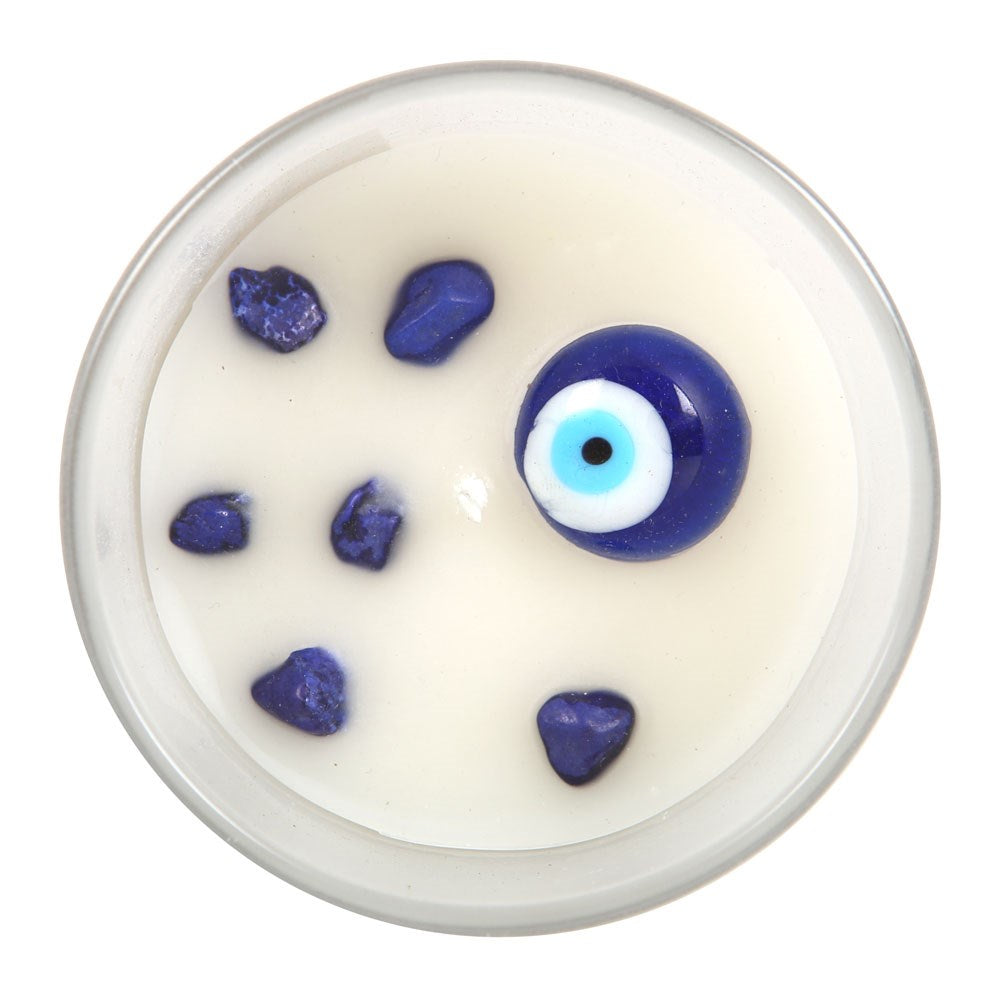 Top view of white sage candle with sodalite crystals