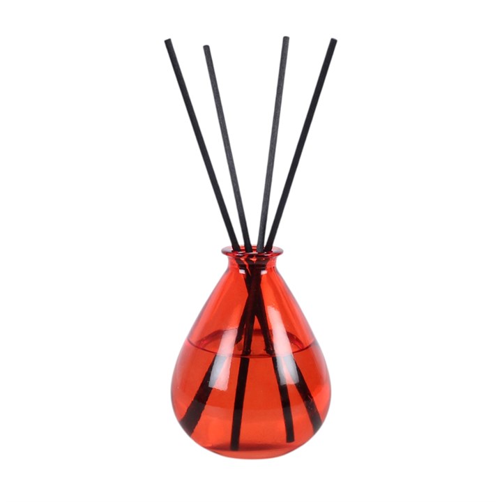 Red glass citrus and spice reed diffuser with black reeds