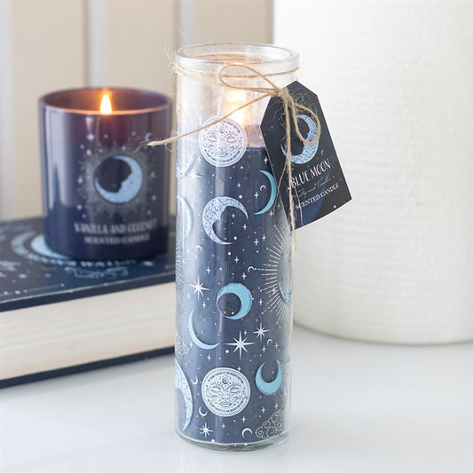 Candle in a glass jar with celestial design, lit candle in the background