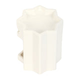 White geometric candle holder on a white background