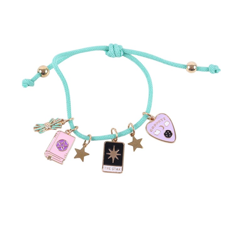 Turquoise bracelet with various charms on a white background