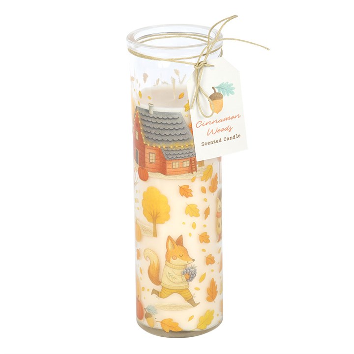 Candle with fox and cabin design on a white background
