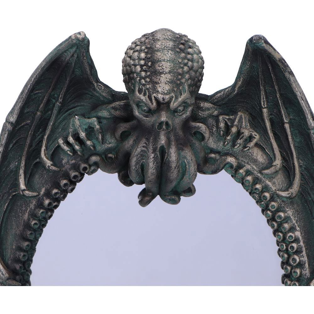 Close-up of winged Cthulhu design on gothic mirror