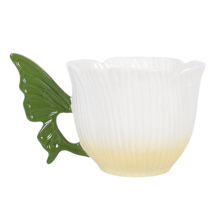 White flower teacup with sculpted green fairy wing handle