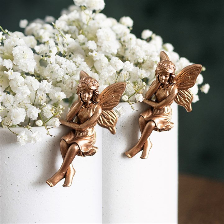 Set of 2 antique bronze fairy pot hanger ornaments on plant pot