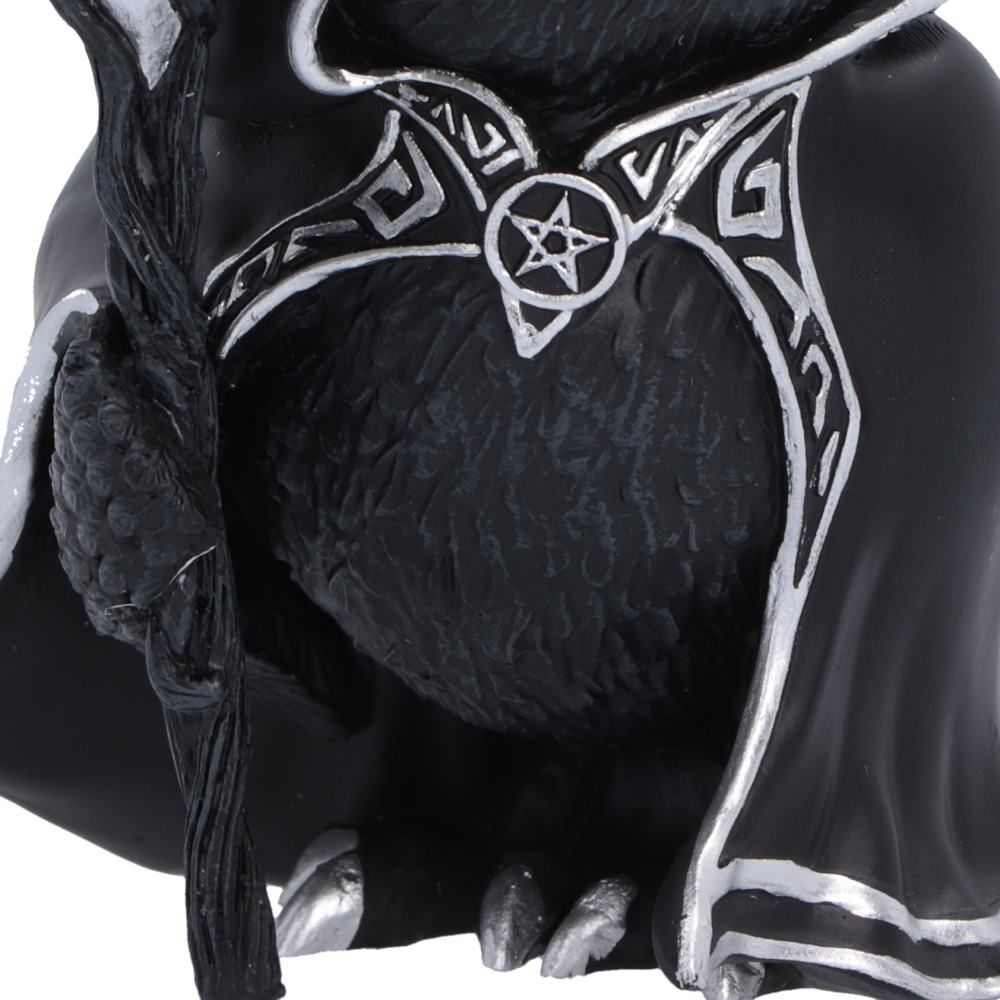 Close-up of Featheros bird figurine holding its magical staff