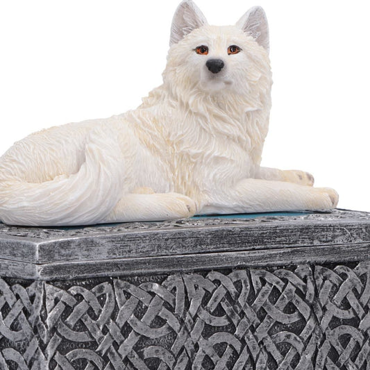 Close-up of white wolf figurine and intricate box detailing