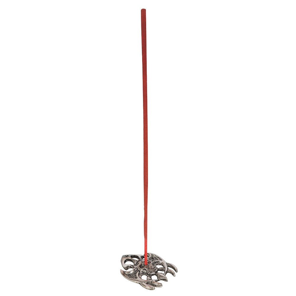 Rose incense stick displayed in metal gothic holder