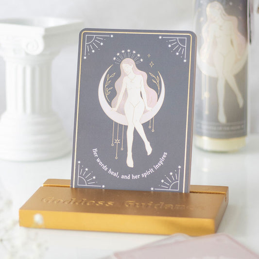 Goddess affirmation card displayed in wooden stand