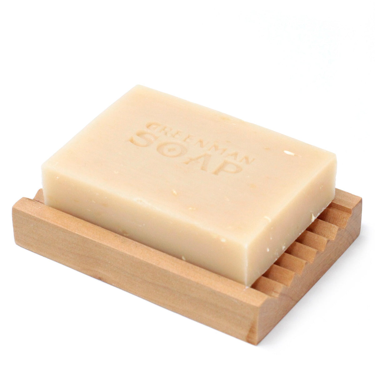 Greenman coconut and lime soap on wooden soap dish