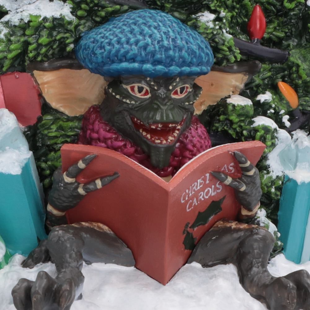 Carolling Gremlin detail on Christmas Snow Globe