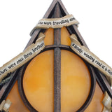 Close-up of the inscriptions on the Deathly Hallows lamp
