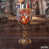 Decorative goblet with intricate design on a wooden surface, featuring 'Harry Potter' branding.