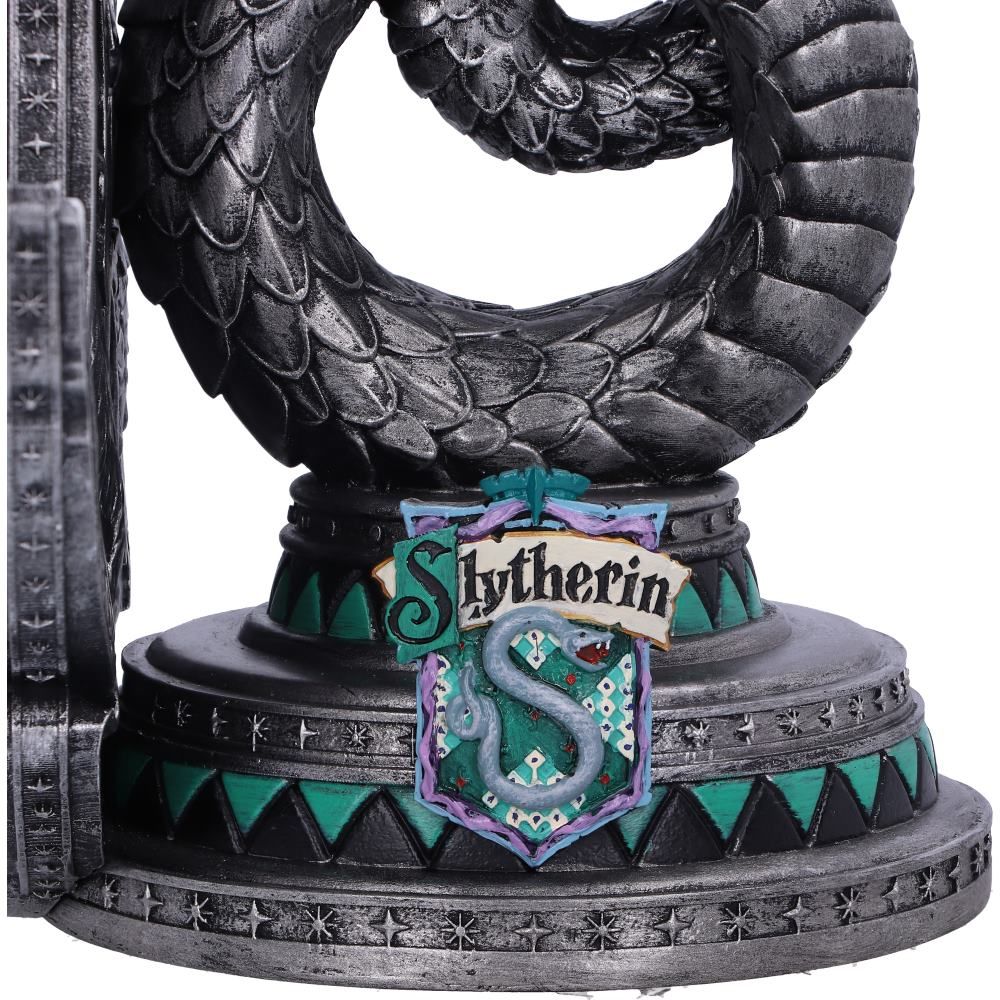Close-up of Slytherin house crest and serpent detail