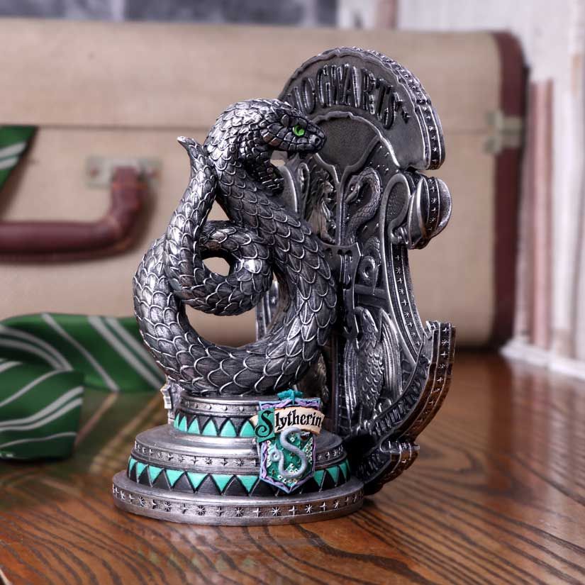 Slytherin bookend displayed beside books