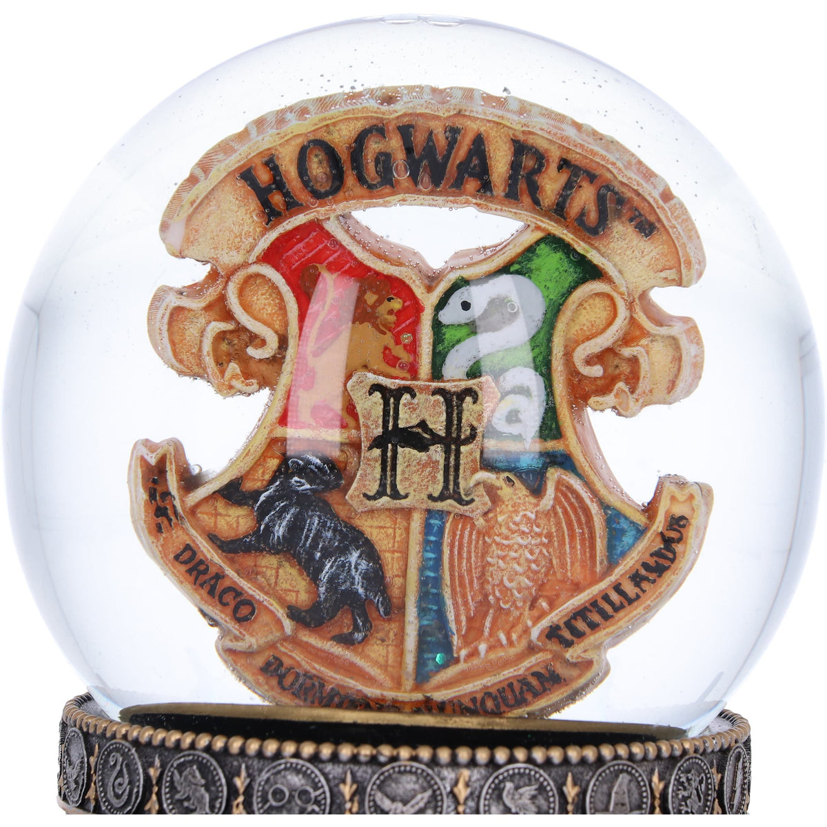 Close-up of Hogwarts crest inside Harry Potter snow globe