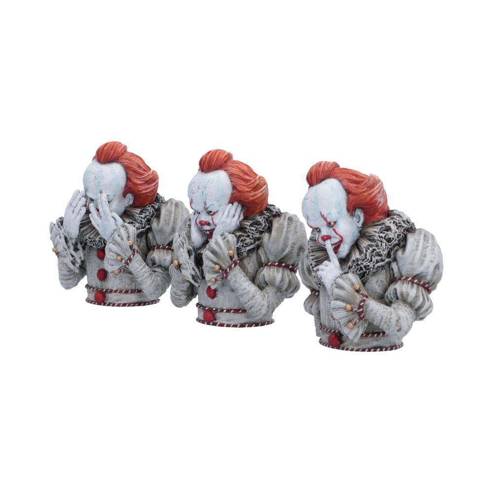 Three Pennywise clown figurines in See No Evil poses