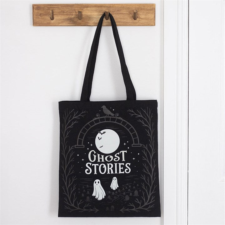 Ghost Stories tote bag hanging on door