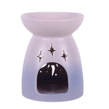 Purple oil burner with cut-out star pattern.