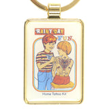 Keychain with illustration of two people and 'Rainy Day Fun Home Tattoo Kit' text on a gold border.