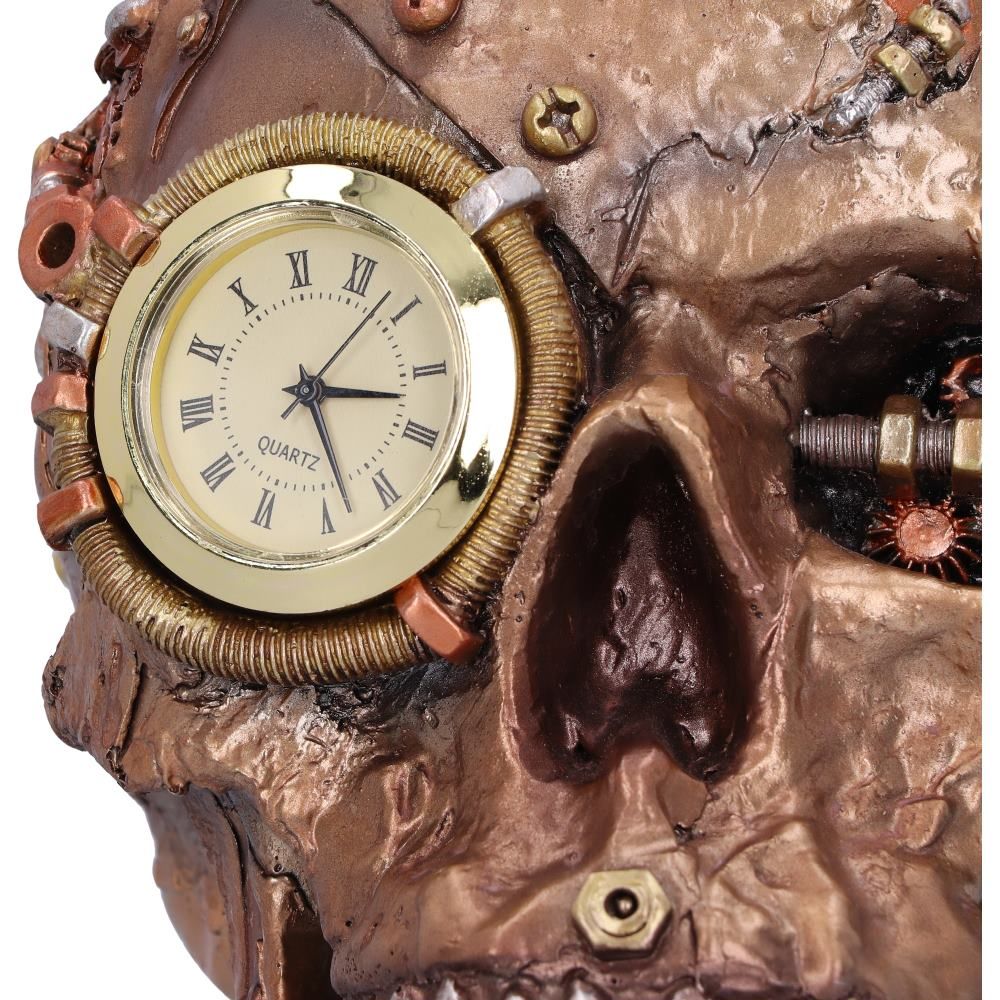 Close-up of clock and mechanical skull detailing