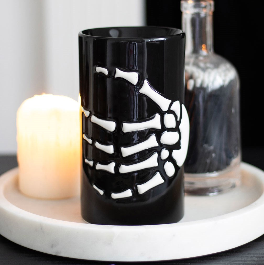 Black skeleton hand oil burner