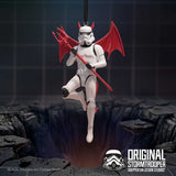 Original Stormtrooper devil hanging ornament displayed above rocky ground