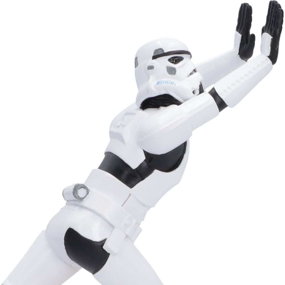 Close-up of working Stormtrooper pushing against books