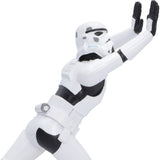 Close-up of working Stormtrooper pushing against books