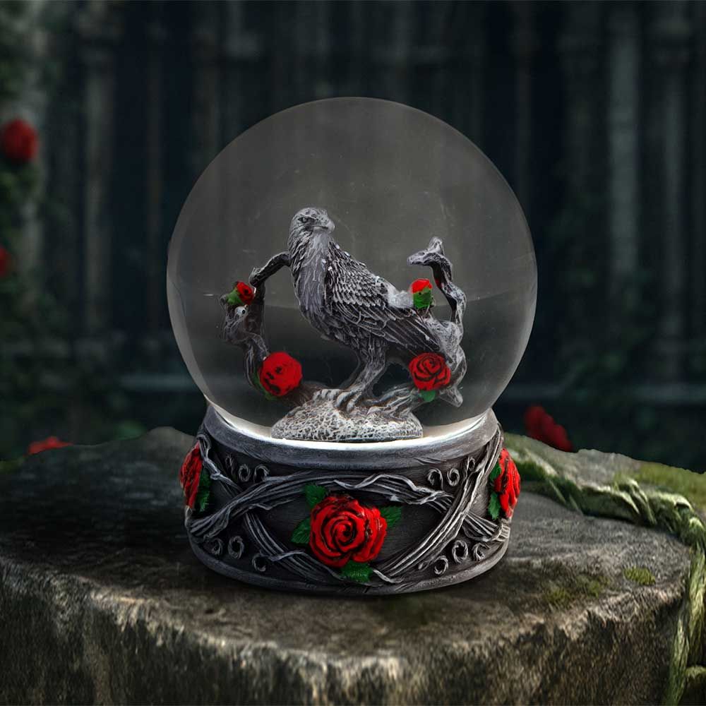 Twilight Bloom gothic raven and red roses snow globe displayed