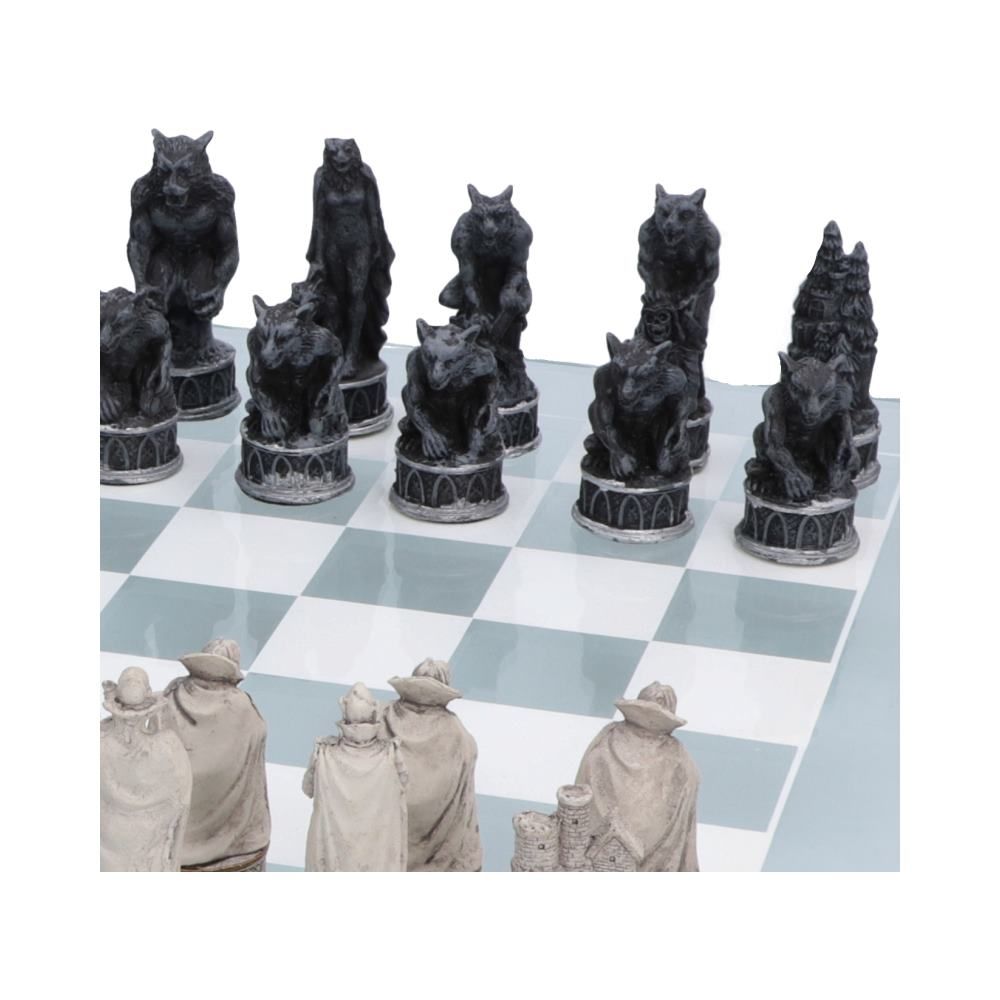 Werewolf chess pieces on decorated glass chess board