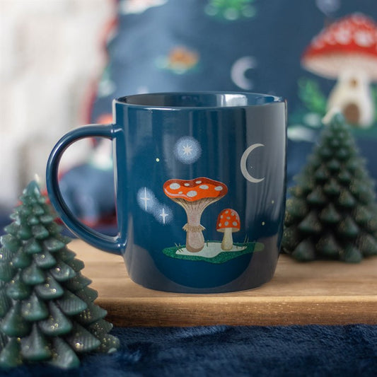 Navy mushroom and toadstool ceramic mug in woodland setting