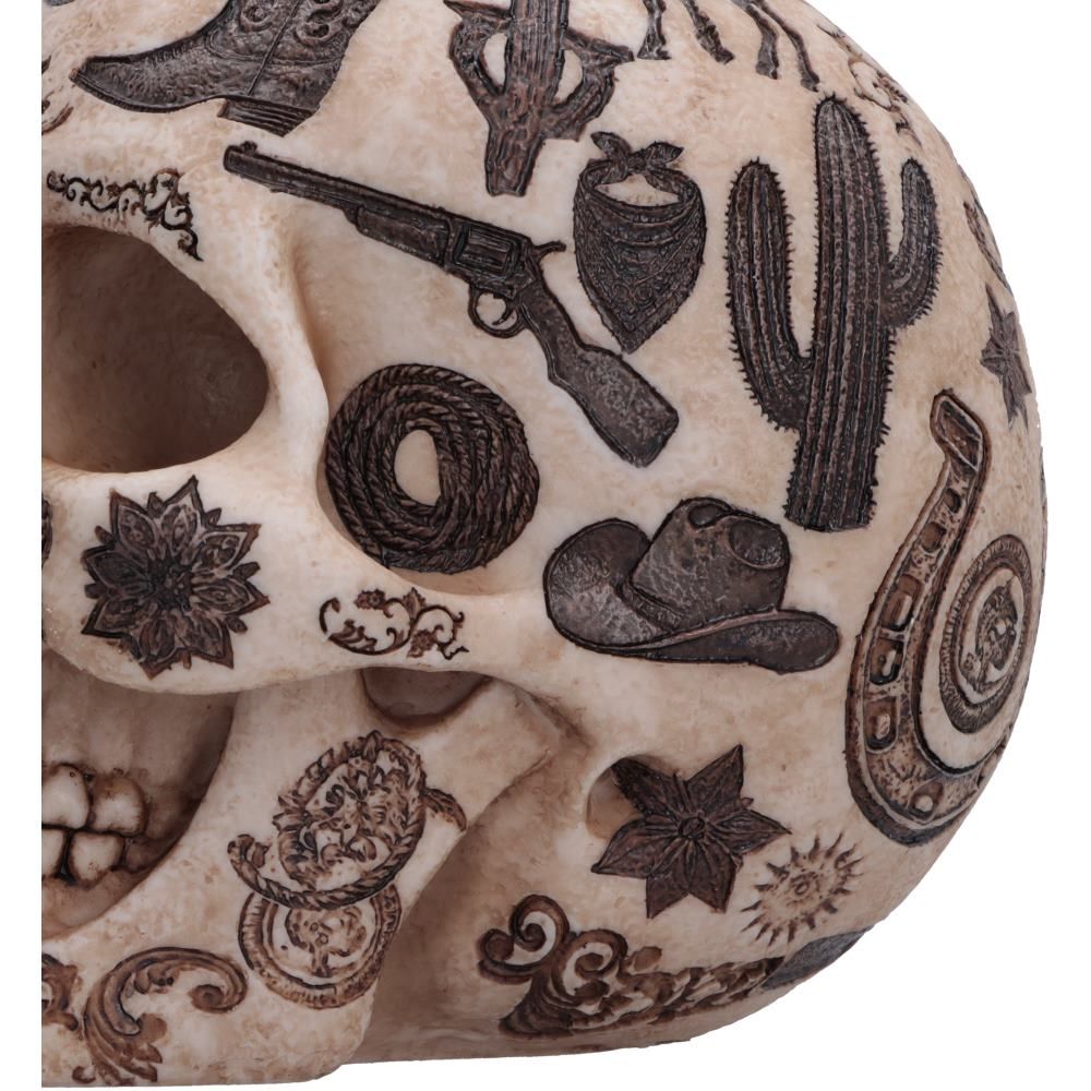 Close-up of cowboy boot and frontier artwork on the skull