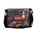 Messenger bag with a black cat and candle design on a white background