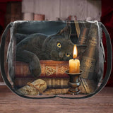 Satchel with a black cat and candle design on a wooden surface