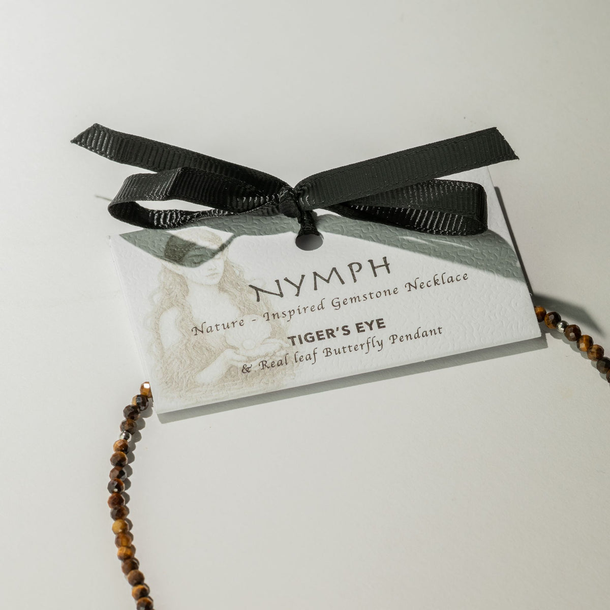 Tiger's Eye butterfly necklace with Nymph presentation card and black ribbon