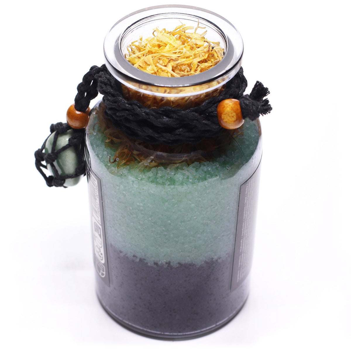 Layered botanical bath potion with marigold and aventurine crystal