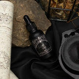 Ancient Witch Lost in Sin perfume oil bottle on a witch's altar